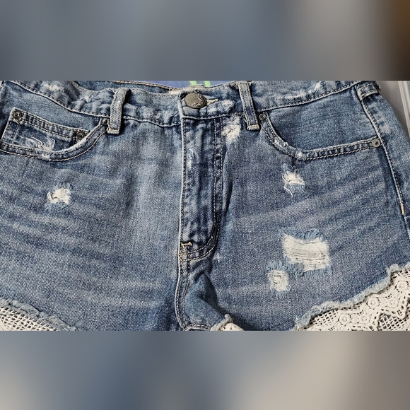 Free people | High-Waisted Medium Wash Jean Shorts with Distressing and Lace Hem - Picture 6 of 8